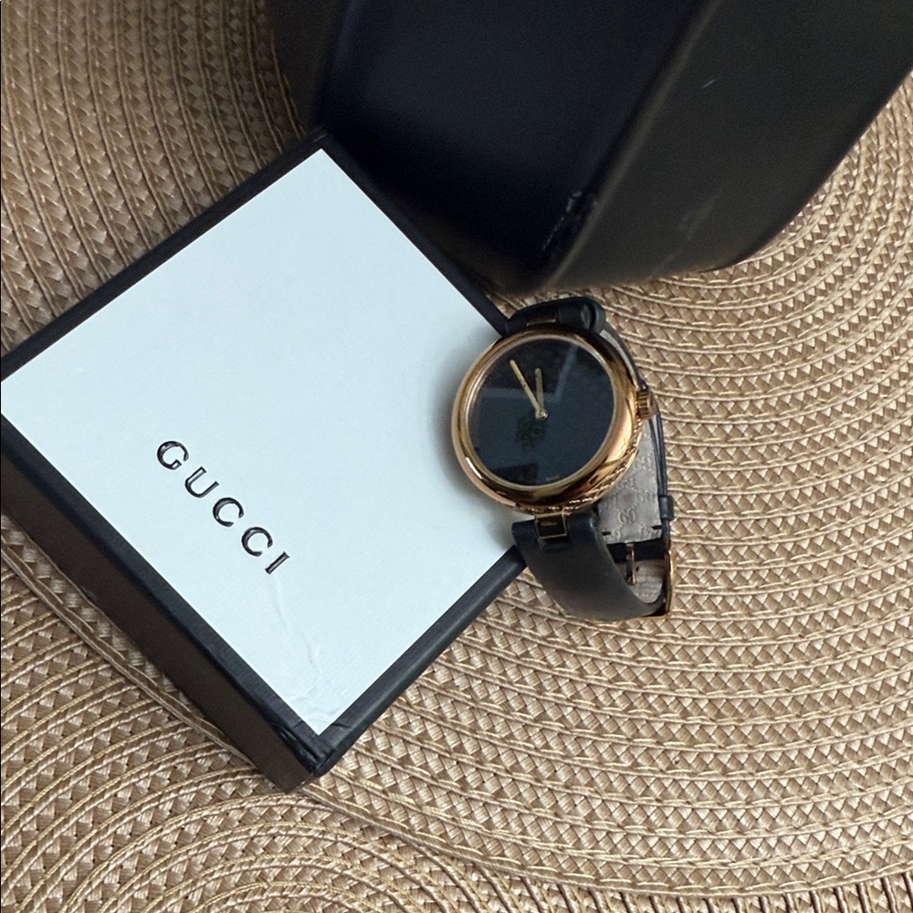 Gucci Black and Gold Timepiece
